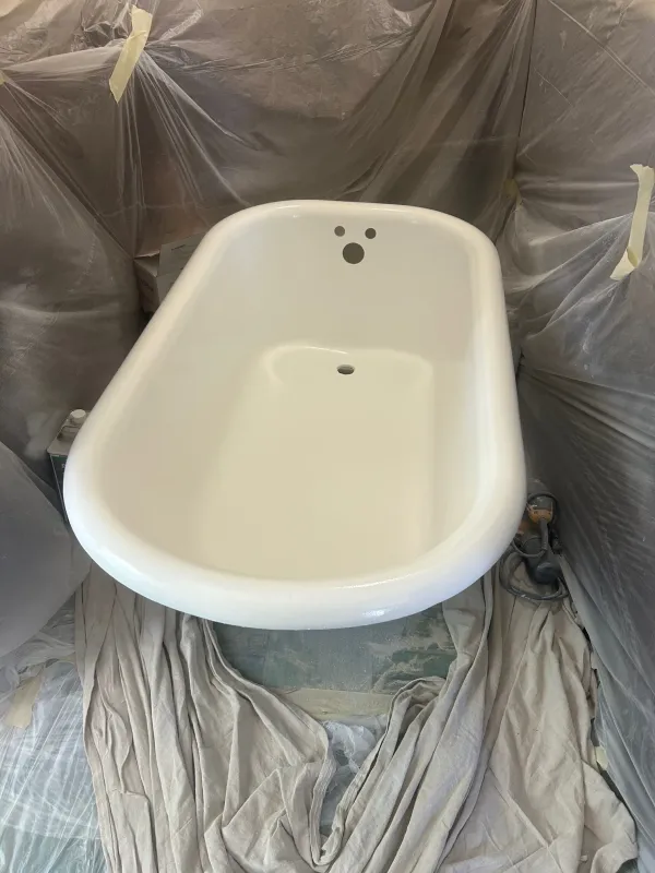 Clawfoot tub after reglazing with a clean glossy white finish