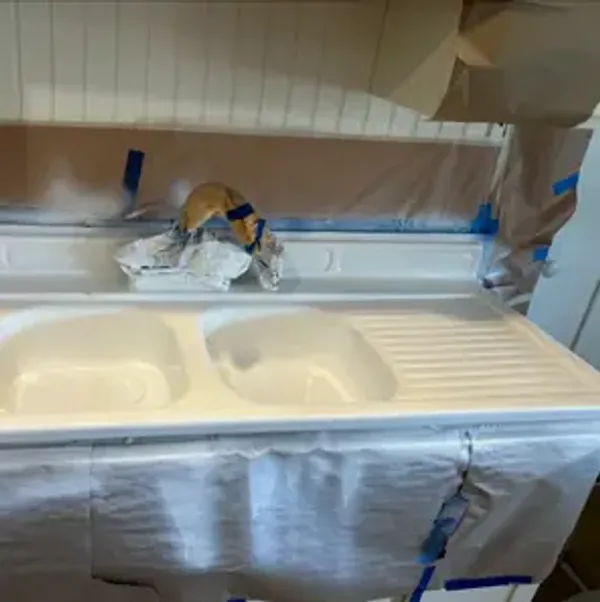 Finished kitchen sink and counter surface after refinishing