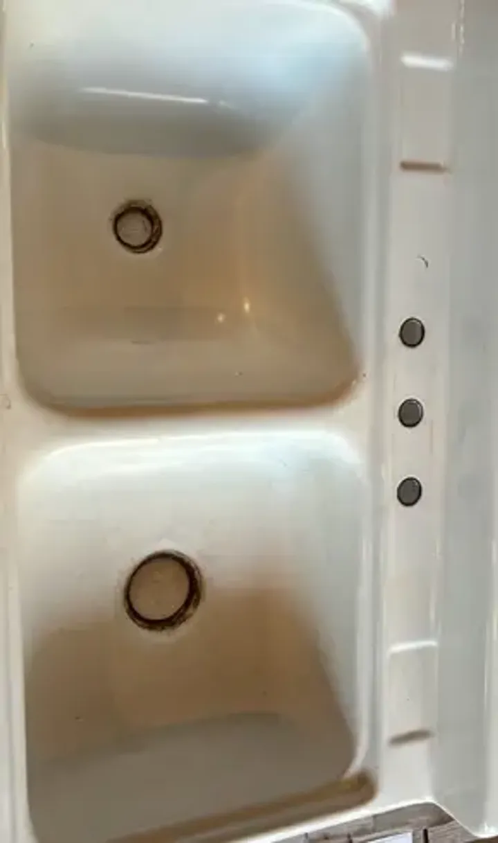 Worn double sink before refinishing