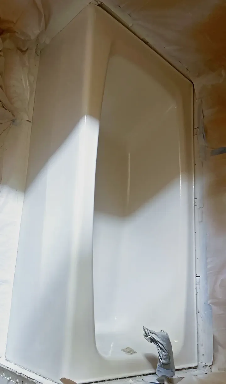 Yellow bathtub after reglazing with a clean white finish